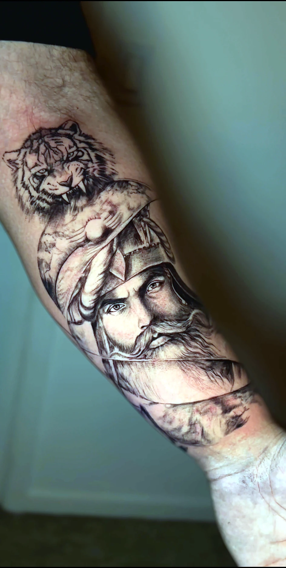Black and grey realism tiger and Sikh warrior composition by Rav Singh at Inkology