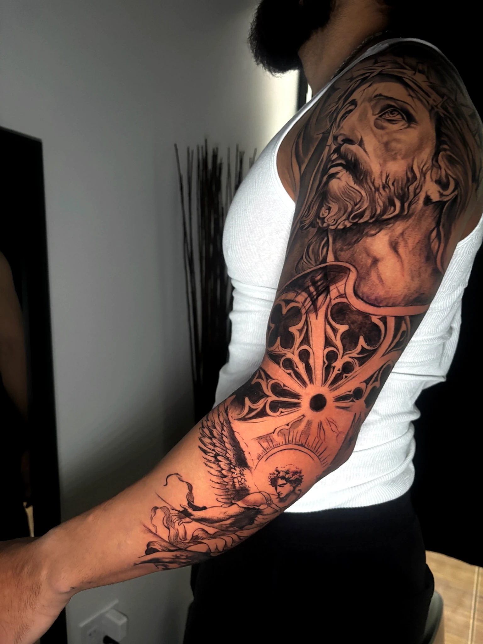 Black and grey realism full religious sleeve by Rav Singh at Inkology